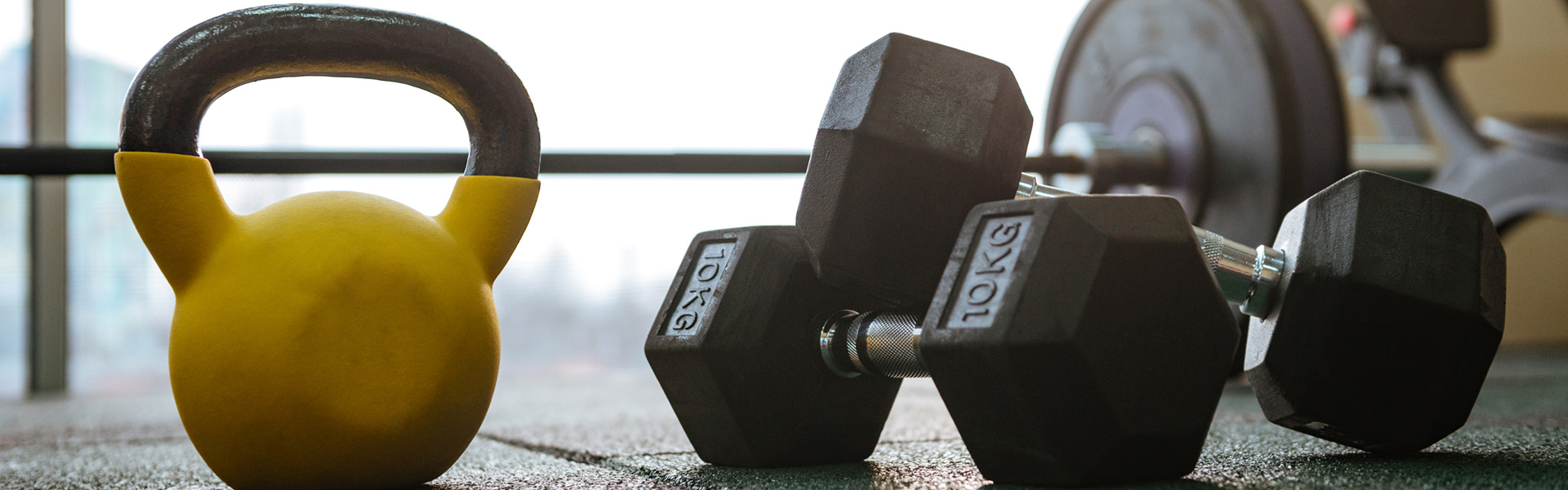 photo-of-sport-equipment-in-gym-dumbbells-on-floor